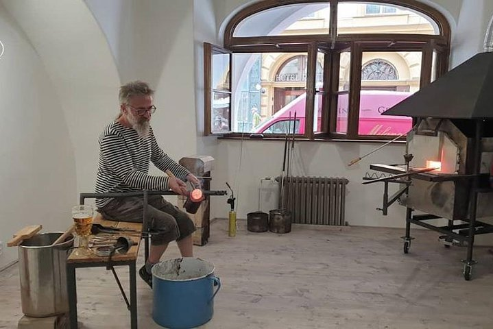 Experience the art of glassblowing in Prague as skilled artisans showcase their techniques. Create your own masterpiece and unwind with a local beer afterward. A truly unique adventure awaits!